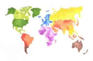 The world map is made with colored watercolor paints on white paper