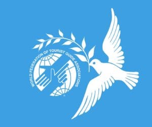 dove of peace with branch above WFTGA logo
