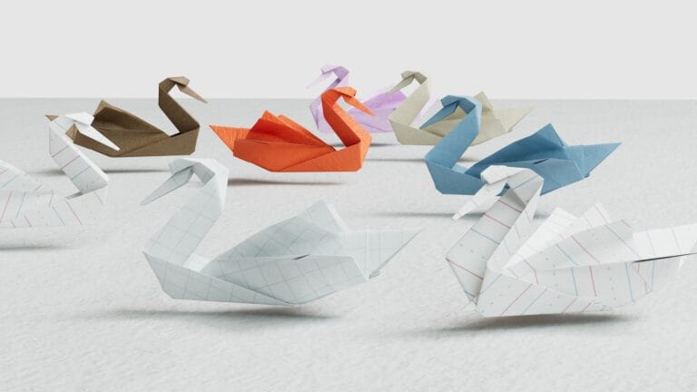 a group of origami swans sitting on top of a table