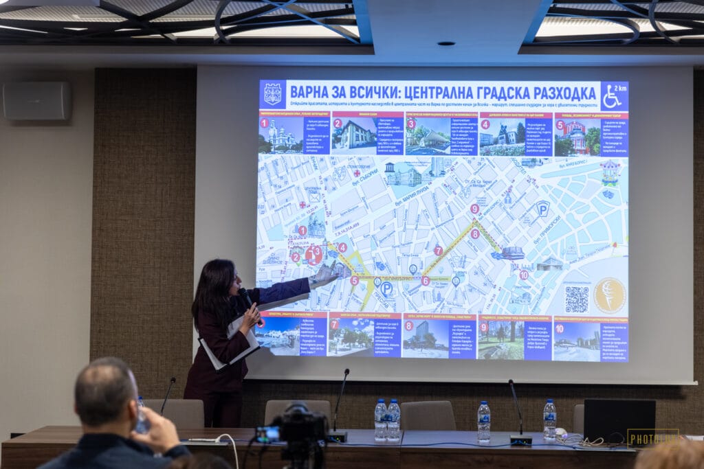 A speaker presenting a city map to tourist guides at a member association conference in Bulgaria