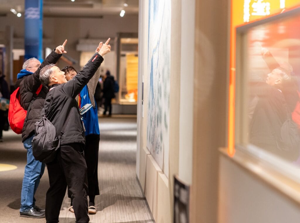 Tourist guides exploring an exhibition at the Fukuoka City Museum
