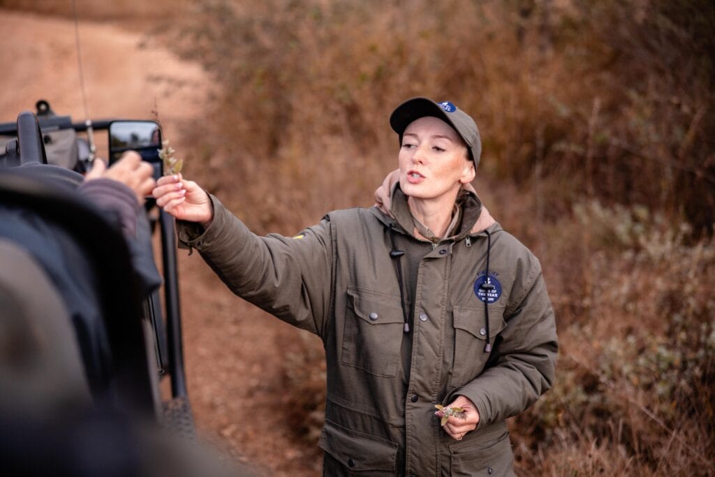 Tourist guide Sarah Barratt guiding a group outdoors