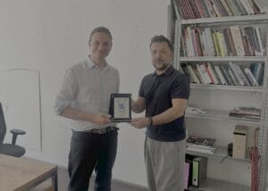 WFTGA President Sebastian Frankenberger and Local & Traveler Co-Founder Engin Ozkaragoz exchanging the Official Partnership plaque in Vienna
